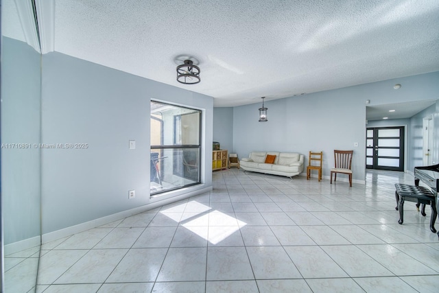 tiled living room with a textured ceiling