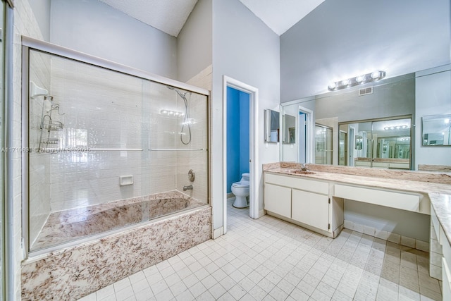 full bathroom featuring vanity, toilet, and tiled shower / bath combo