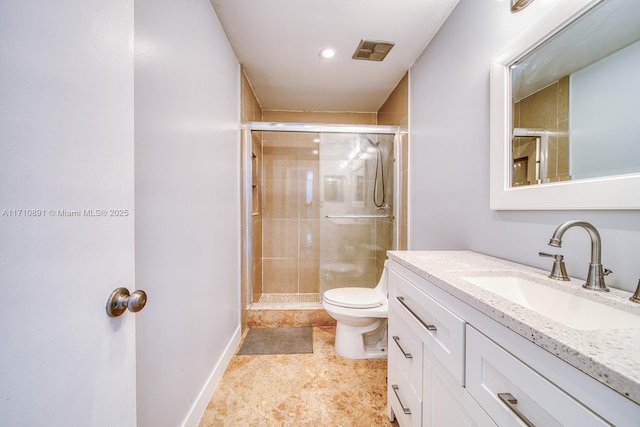 bathroom with vanity, toilet, and walk in shower