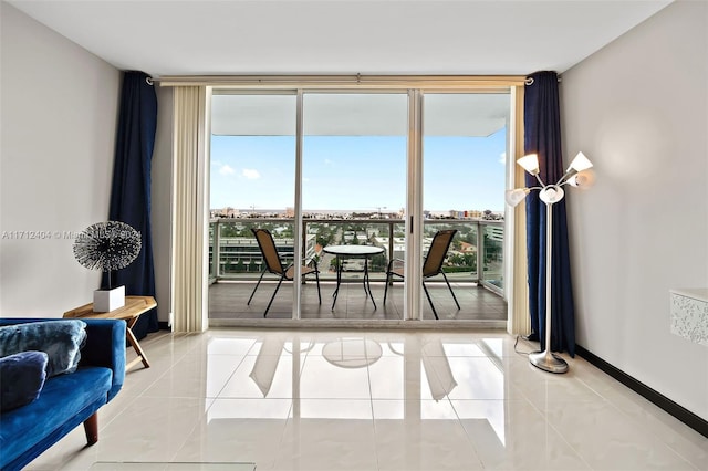 dining space with floor to ceiling windows, light tile patterned floors, and a wealth of natural light