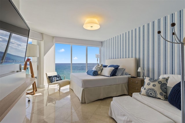 bedroom featuring a water view