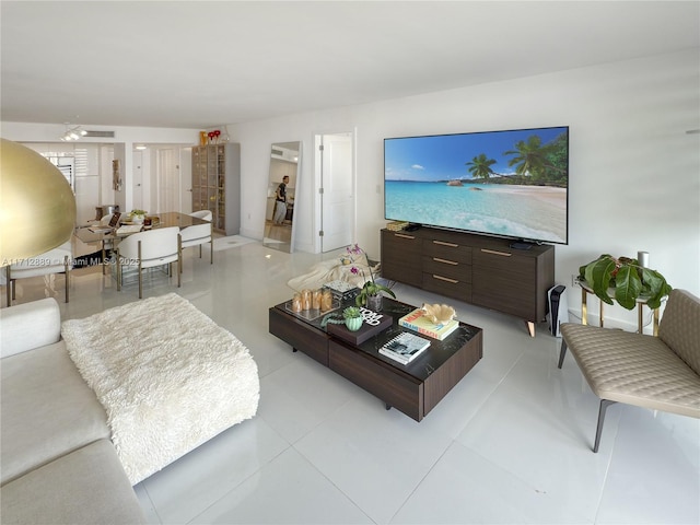 living area with light tile patterned floors