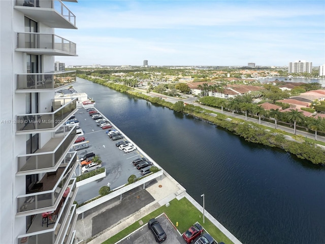 birds eye view of property with a view of city and a water view