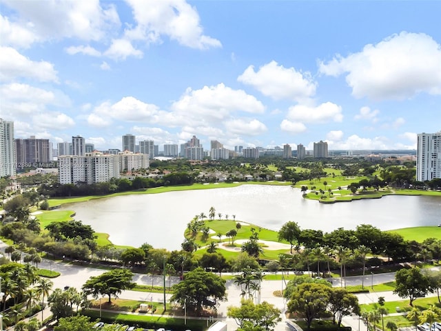 view of water feature with view of golf course and a city view