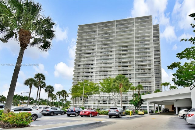 view of property featuring uncovered parking