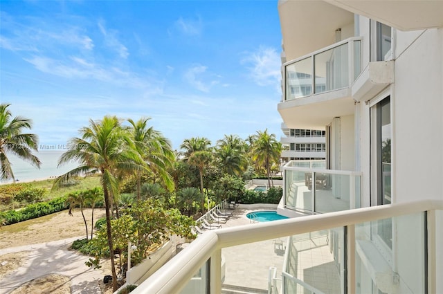 balcony featuring a water view