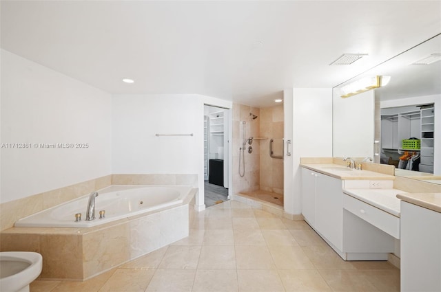 bathroom featuring a bidet, tile patterned flooring, vanity, and independent shower and bath