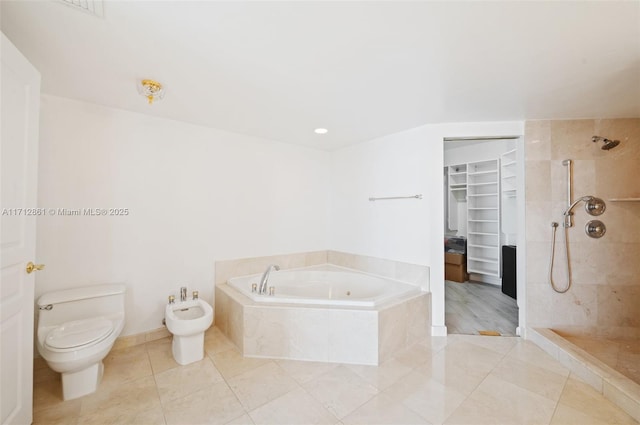 bathroom with toilet, tile patterned floors, a bidet, and plus walk in shower