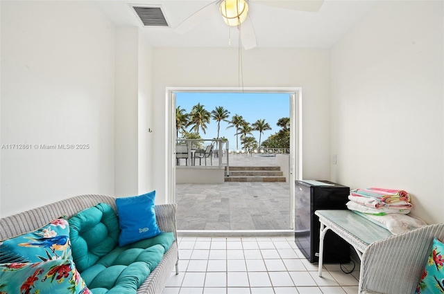 interior space featuring ceiling fan and light tile patterned floors