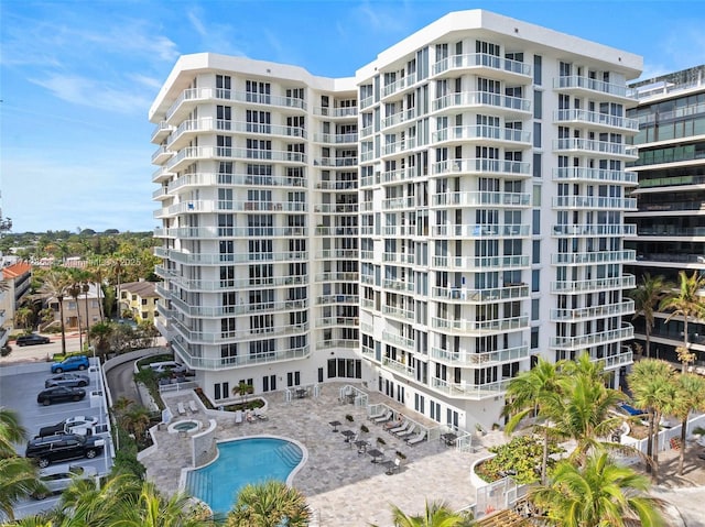 view of building exterior with a community pool