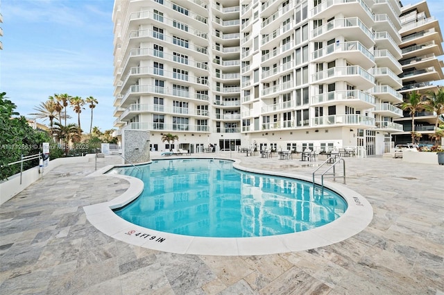 view of swimming pool with a patio