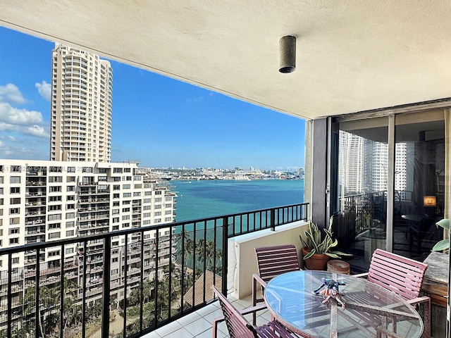 balcony featuring a water view