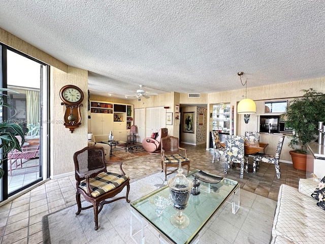 520 Brickell Key Dr Unit A1802, Miami, FL 33131 - living area featuring a textured ceiling and a ceiling fan