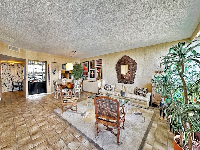 living room featuring a textured ceiling