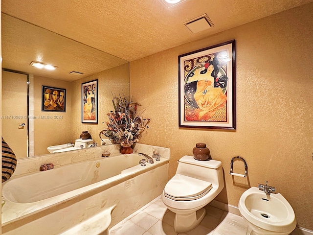 bathroom featuring tile patterned flooring, a textured ceiling, a bidet, and a tub