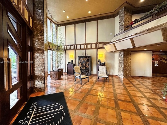 520 Brickell Key Dr Unit A1802, Miami, FL 33131 - building lobby with a towering ceiling, crown molding, and recessed lighting