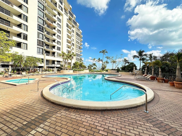 520 Brickell Key Dr Unit A1802, Miami, FL 33131 - community pool featuring a patio