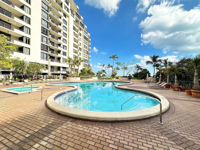 view of swimming pool with a patio area