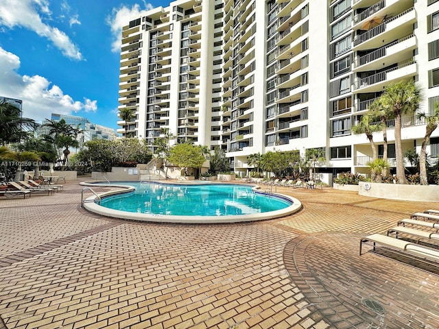 view of pool featuring a patio