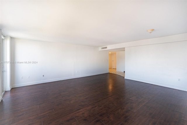 unfurnished room featuring dark hardwood / wood-style floors