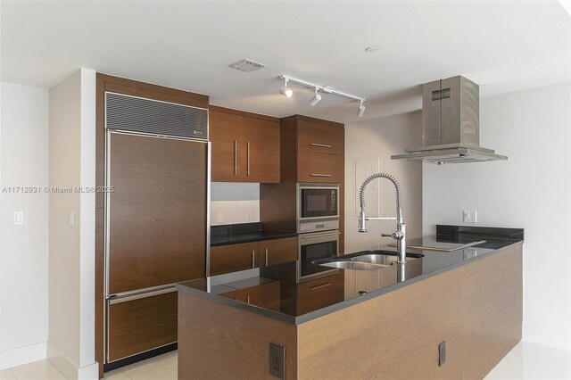 495 Brickell Ave Unit Bay407, Miami, FL 33131 - kitchen with built in appliances, dark countertops, a sink, island range hood, and a peninsula