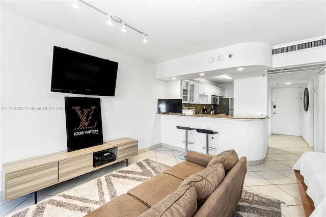 living room with light tile patterned floors