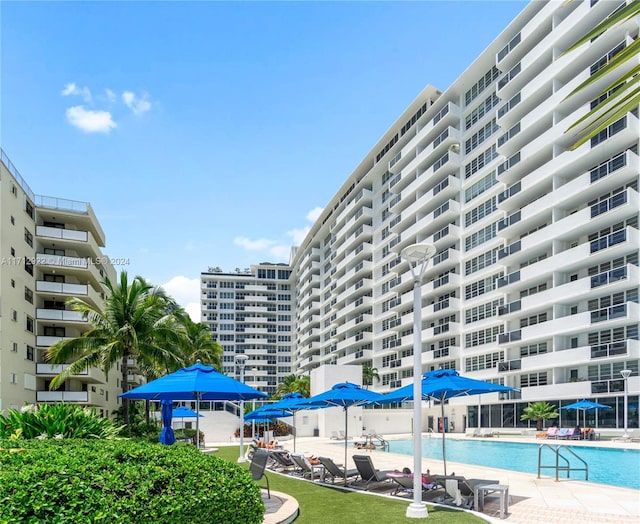 view of building exterior with a community pool