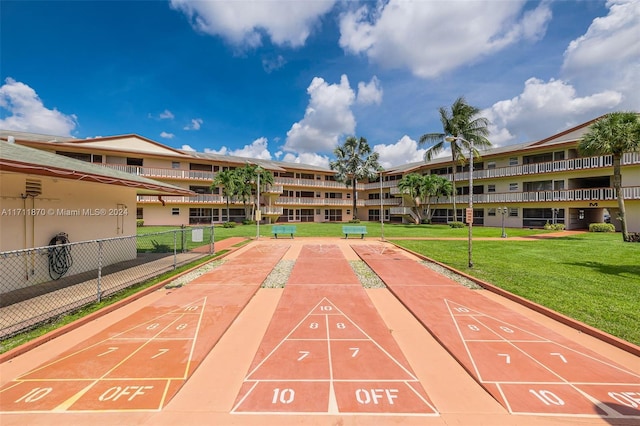 view of home's community featuring a lawn