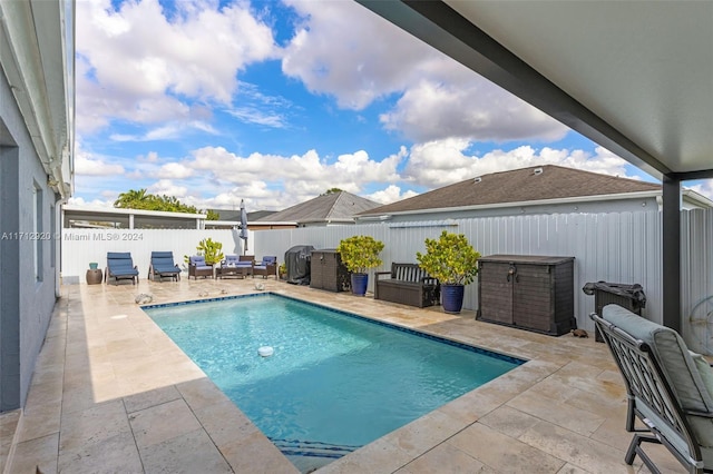 view of swimming pool with an outdoor hangout area and a patio