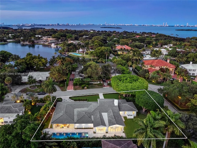 birds eye view of property featuring a water view