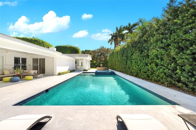 view of pool with ceiling fan, an outdoor hangout area, and a patio