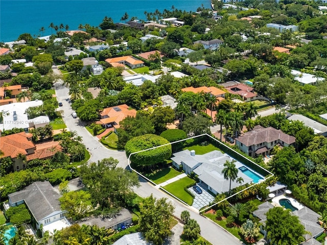 birds eye view of property with a water view and a residential view
