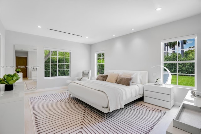 tiled bedroom featuring recessed lighting and baseboards