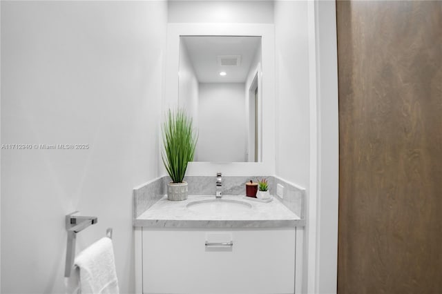 bathroom featuring vanity and visible vents