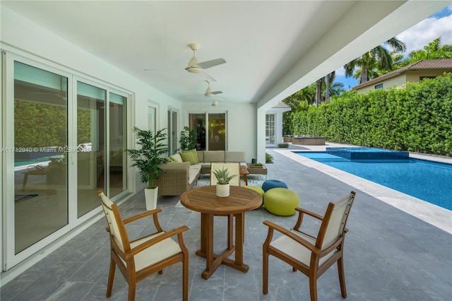 exterior space with a jacuzzi, a pool, and french doors