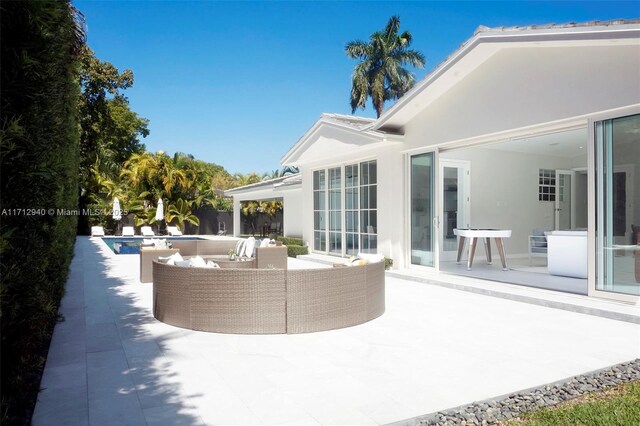 view of patio featuring outdoor lounge area and an outdoor pool