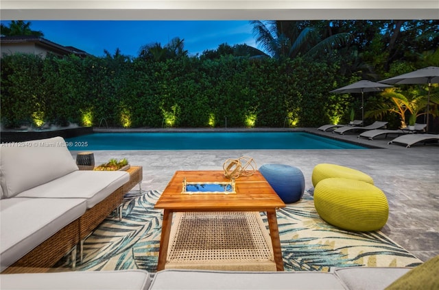 outdoor pool featuring a patio and an outdoor hangout area