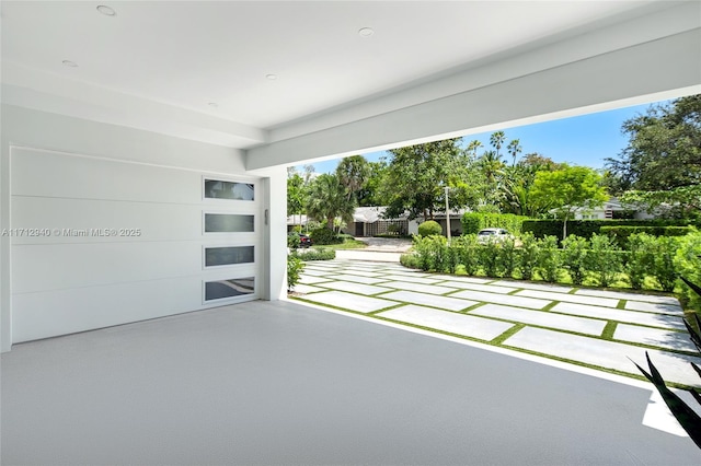 view of patio / terrace with concrete driveway