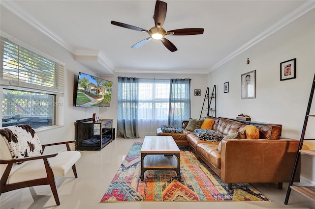 living room featuring crown molding, ceiling fan, and a healthy amount of sunlight