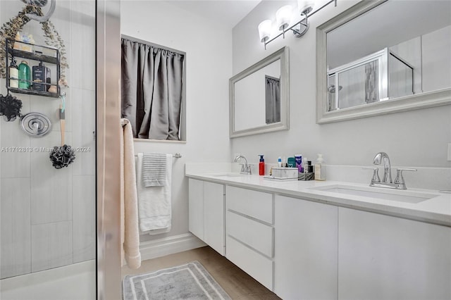 bathroom with a shower with door, vanity, and hardwood / wood-style floors