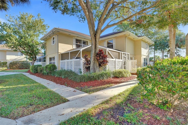 view of front of property with a front lawn