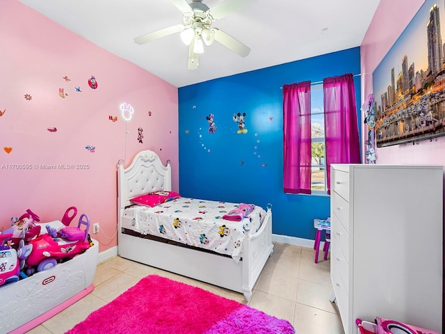 bedroom with ceiling fan, baseboards, and tile patterned floors