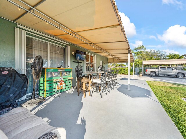 view of patio / terrace with a carport