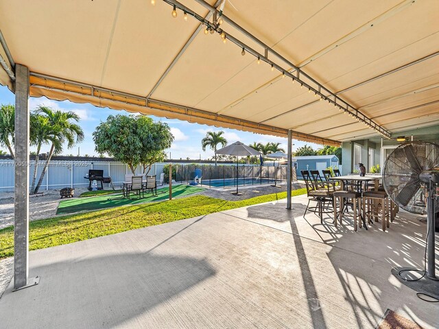 view of patio / terrace featuring a fenced in pool