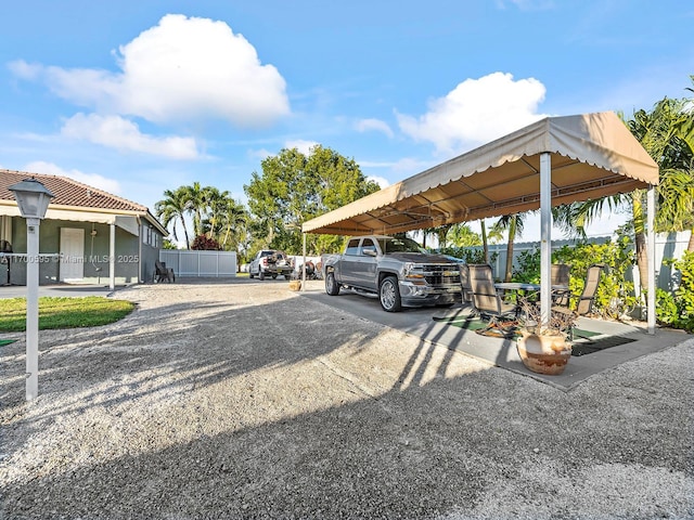 view of parking / parking lot with fence