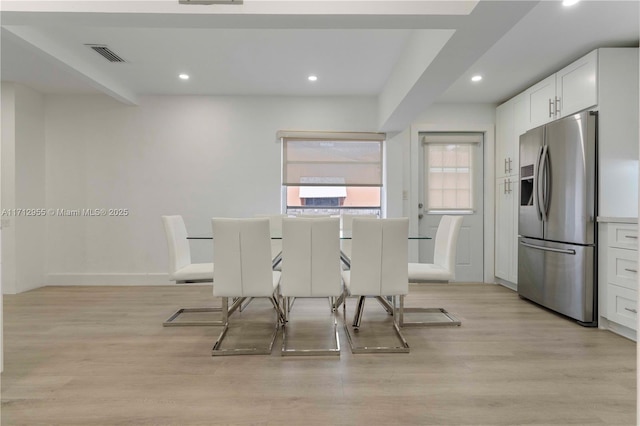 dining room with light hardwood / wood-style floors