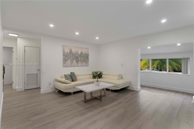 living room with light hardwood / wood-style floors