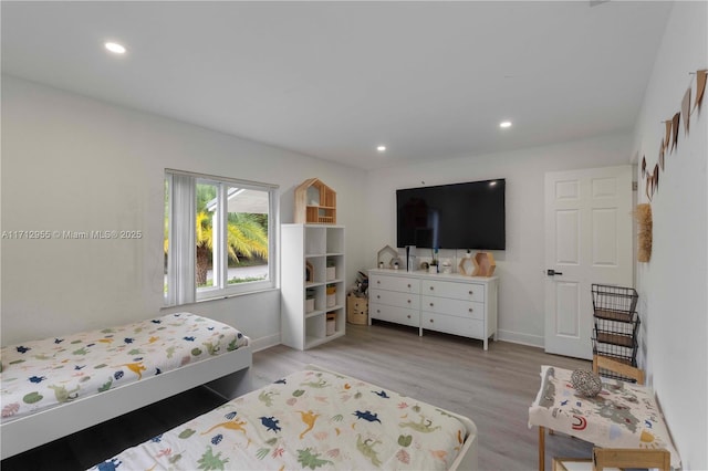 bedroom with light hardwood / wood-style floors