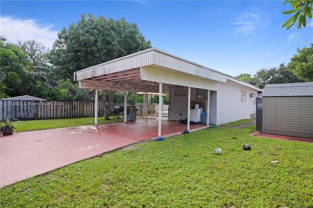 exterior space featuring a shed and a carport