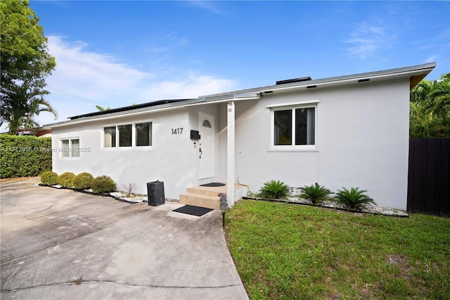 single story home featuring a patio area and a front yard